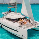 Private catamaran charter sailing on calm blue ocean